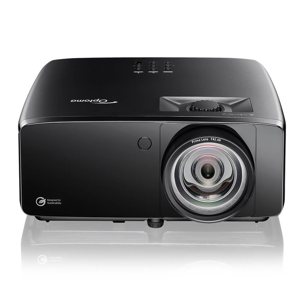 Black Optoma Golf Sim ZK521ST-B True 4K UHD Short Throw 5,000 Lumens Laser Projector with a large lens on the right, control buttons on top, and a sustainability logo on the front.