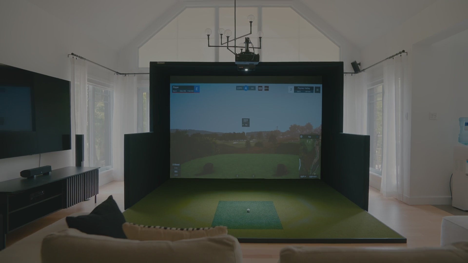 Load video: Custom SimCaddy residential golf simulator installed in a home.